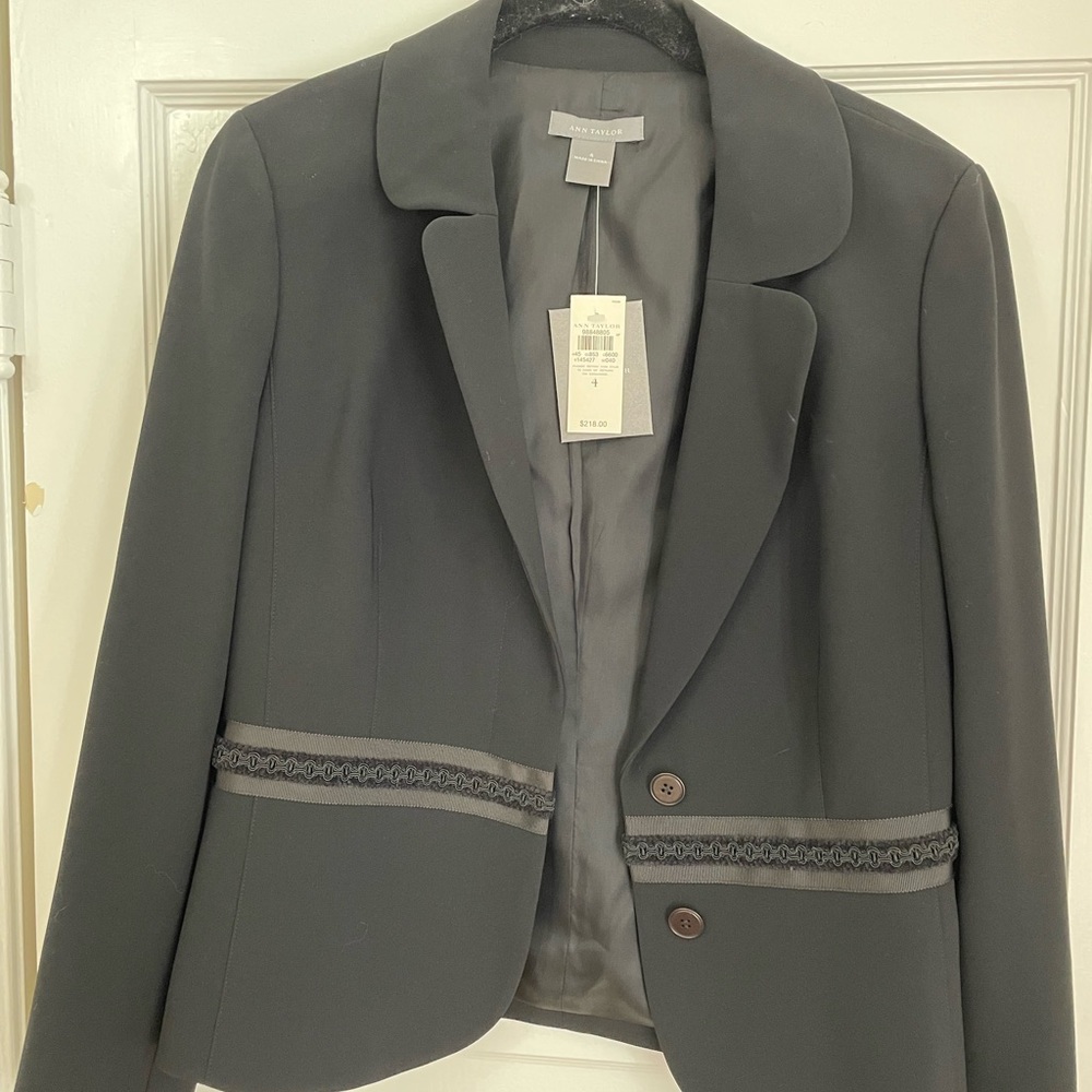 New with tags lovely black Ann Taylor jacket.  Size 4.